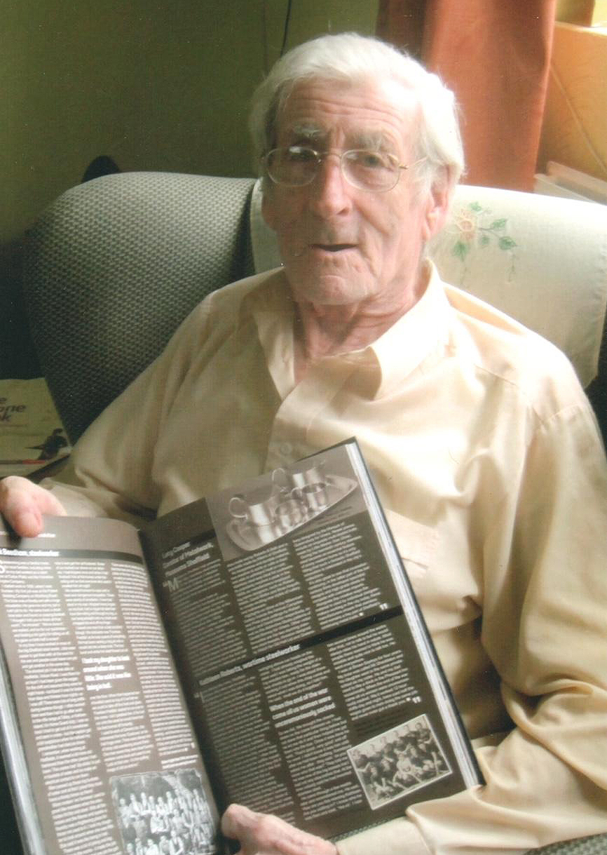 Jack Beedham at home with a Sheffield Star book 100 Years of Stainless Steel, edited by Nancy Fielder (2013). Photo by Ann Beedham.