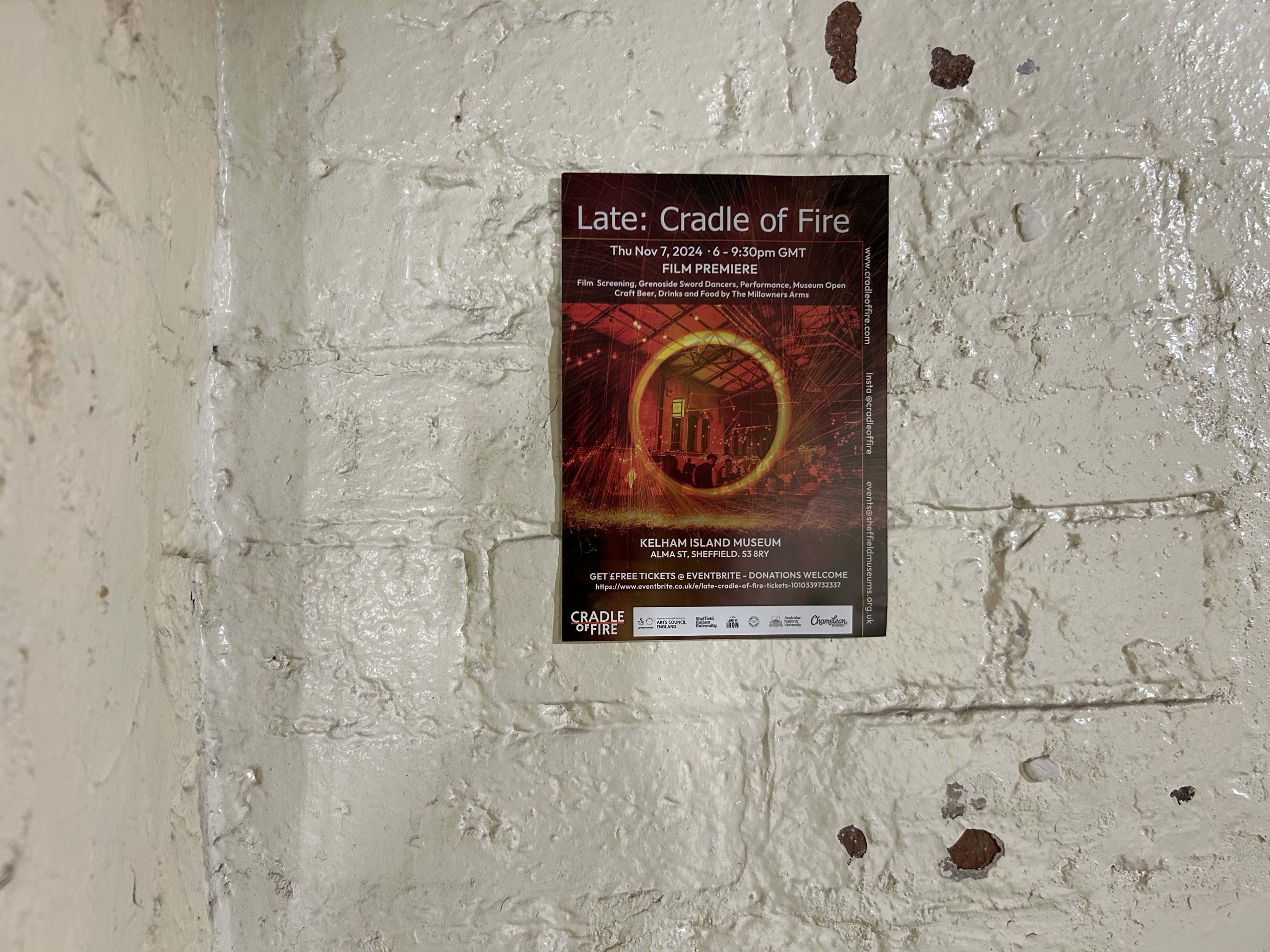 Our Cradle of Fire Film Premiere flyer on the historic walls at Kelham Island Museum © Eileen Haring Woods